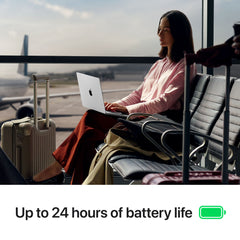 Woman using her 14-inch MacBook Pro M5 Silver in an airport lounge featuring up to 24 hours of battery life at Tradeline.